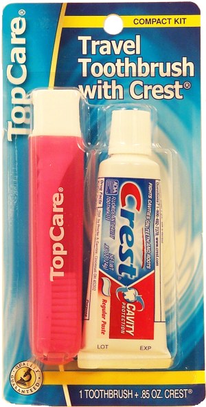 Top Care travel toothbrush with .85 oz Crest, compact kit 1 pack